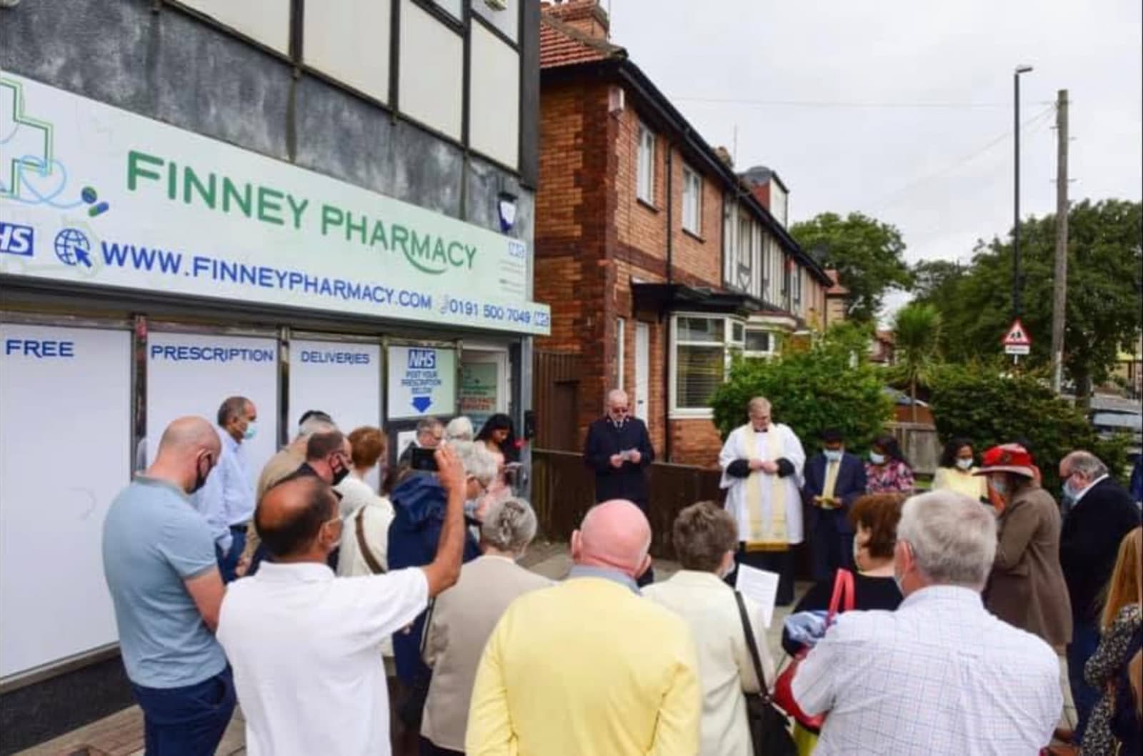 Community gathering for the opening blessing of Finney Pharmacy on Ryhope Road, Sunderland