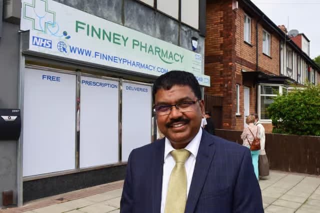 Joseph Arul Finney Abraham outside Finney Pharmacy